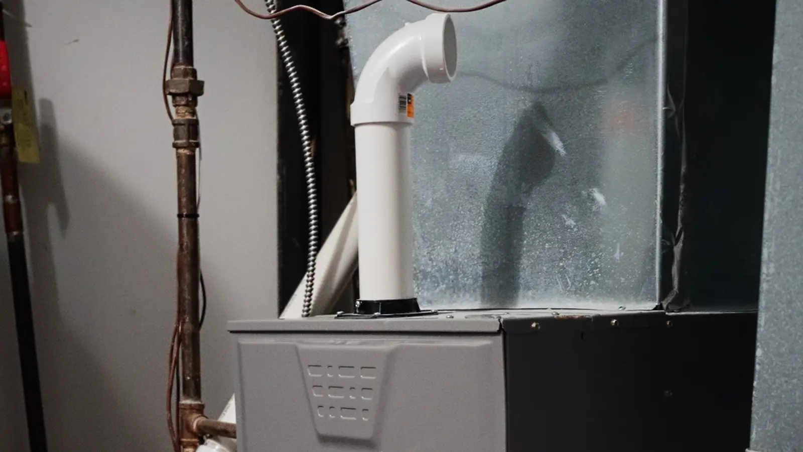 An aging furnace and water heater before replacement