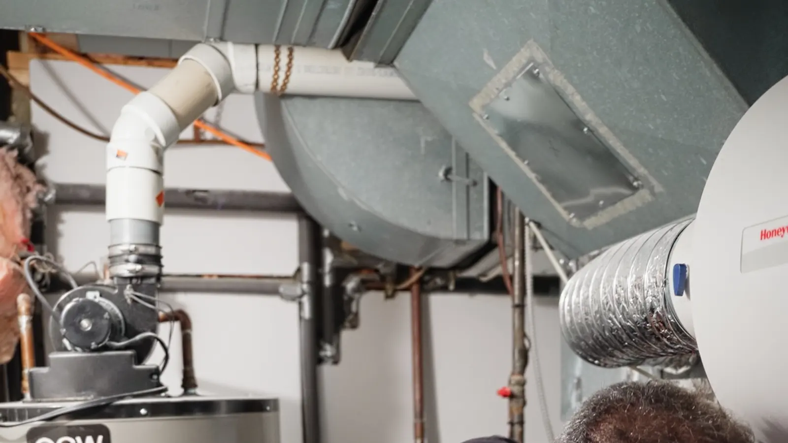 H&C technician servicing a tank water heater