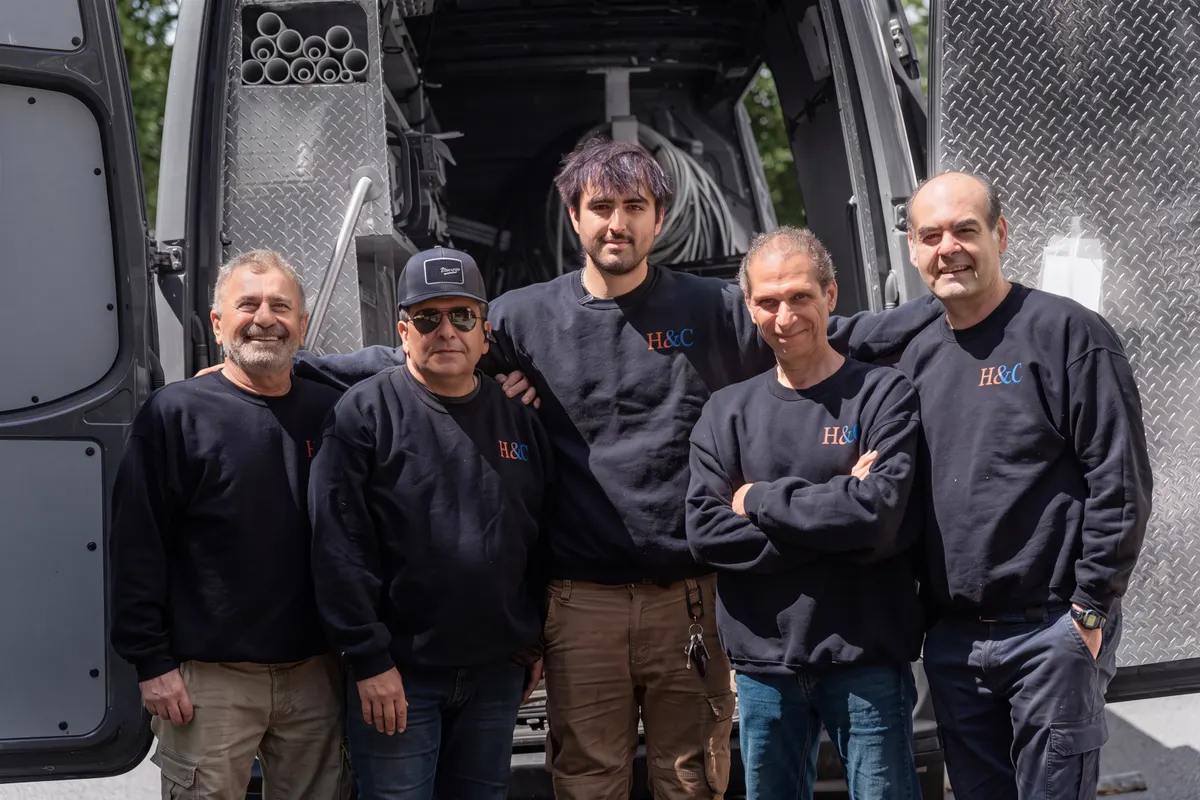 H&C technicians at the back of a stocked service van