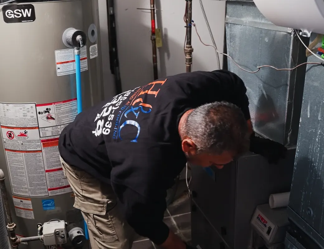 H&C technician diagnosing a tankless water heater