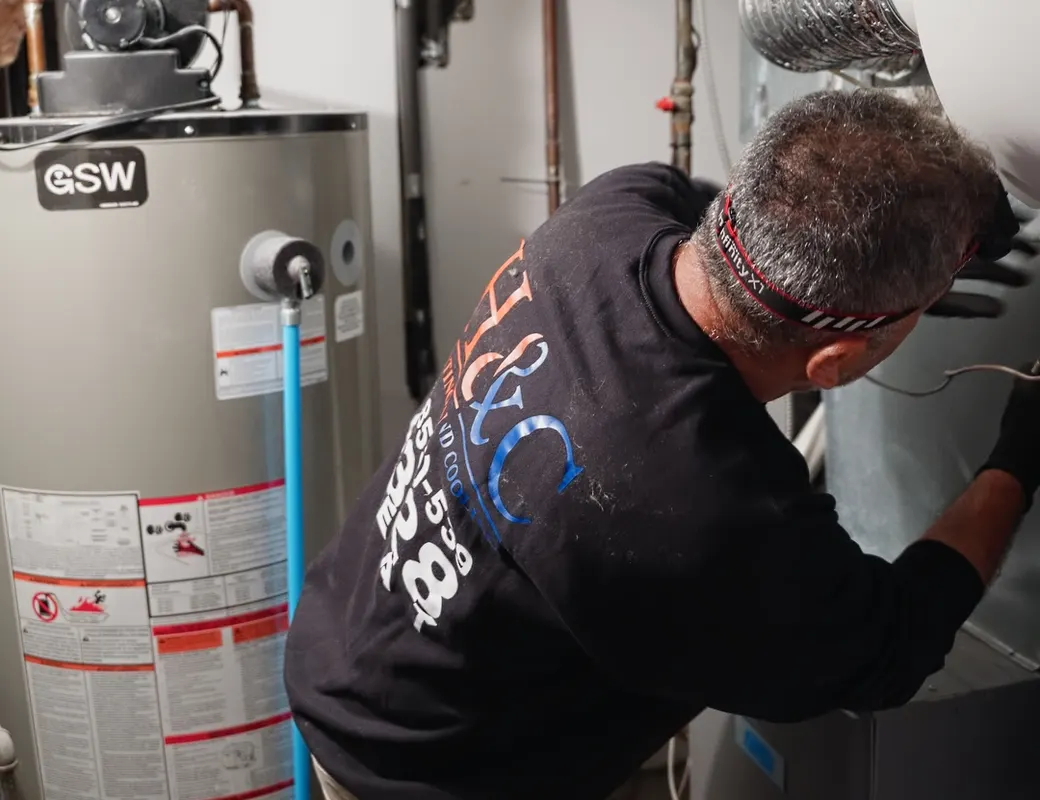 H&C technician repairing a gas water heater in a GTA home